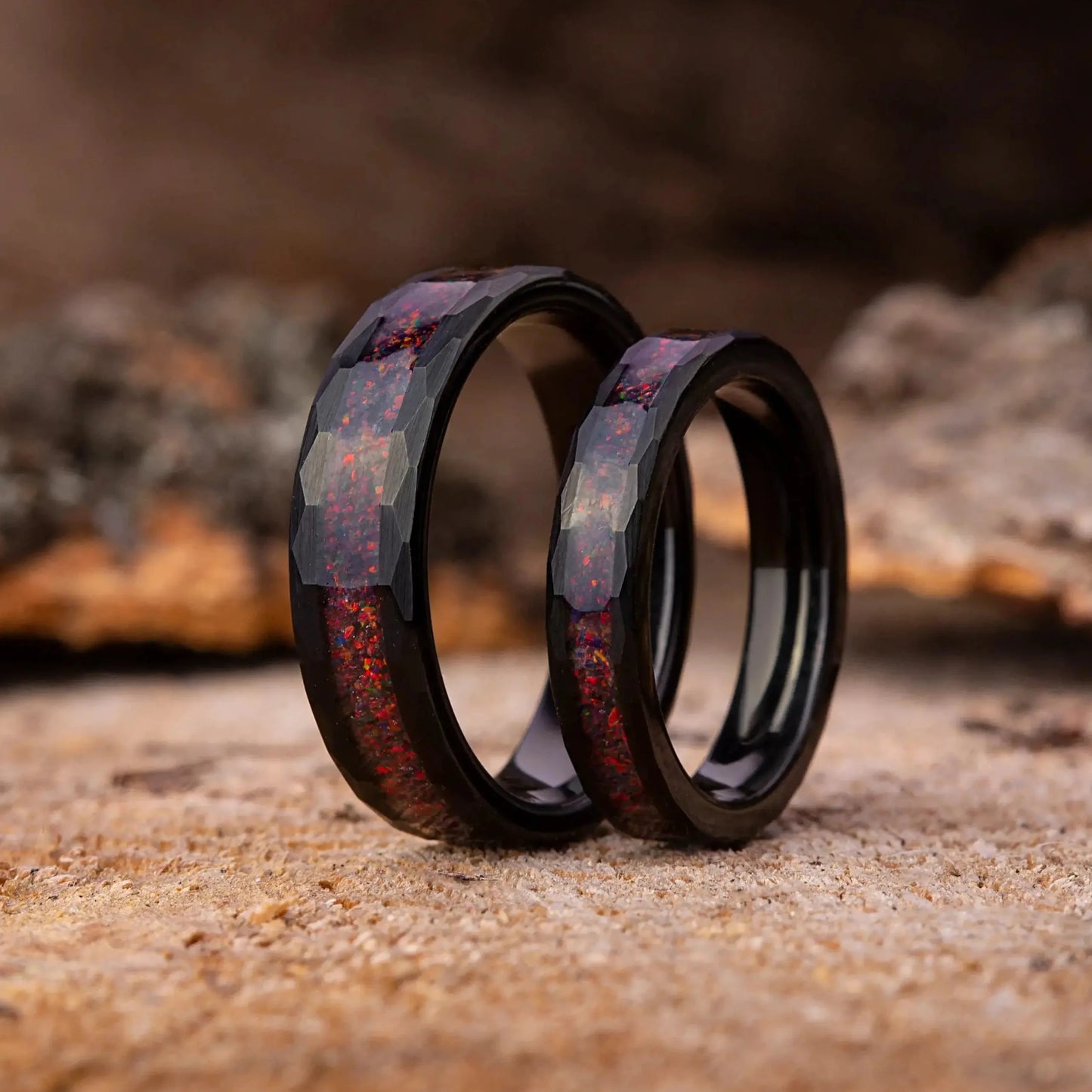 Two wooden rings on a rustic wooden surface