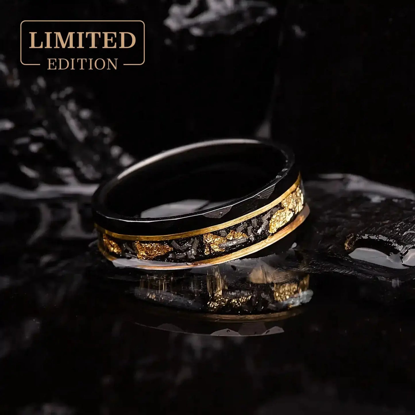 Handmade hammered wedding band for men, featuring a black tungsten design with gold leaf and meteorite inlay for a bold, unique look.