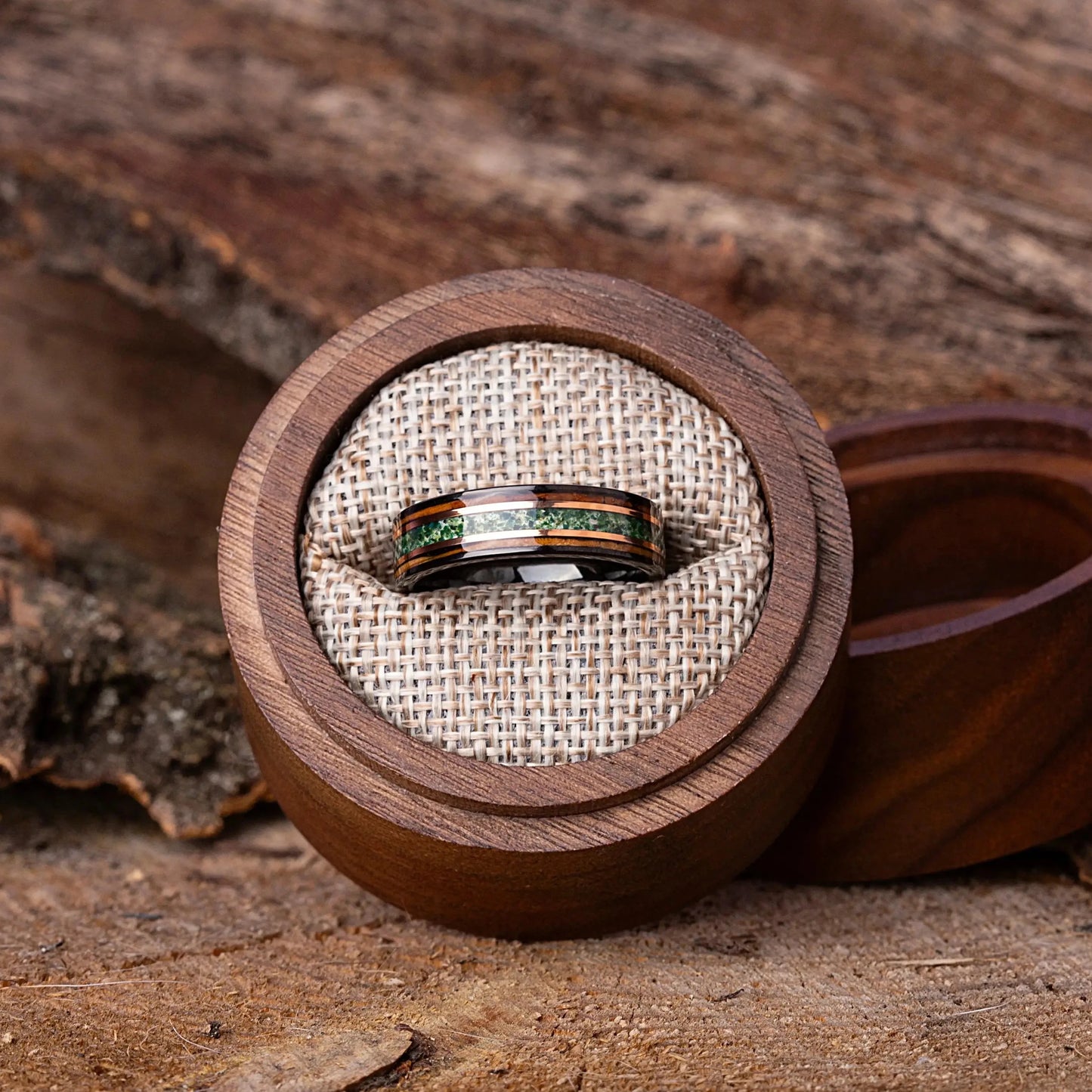 Ring in a wooden box on a rustic wooden surface