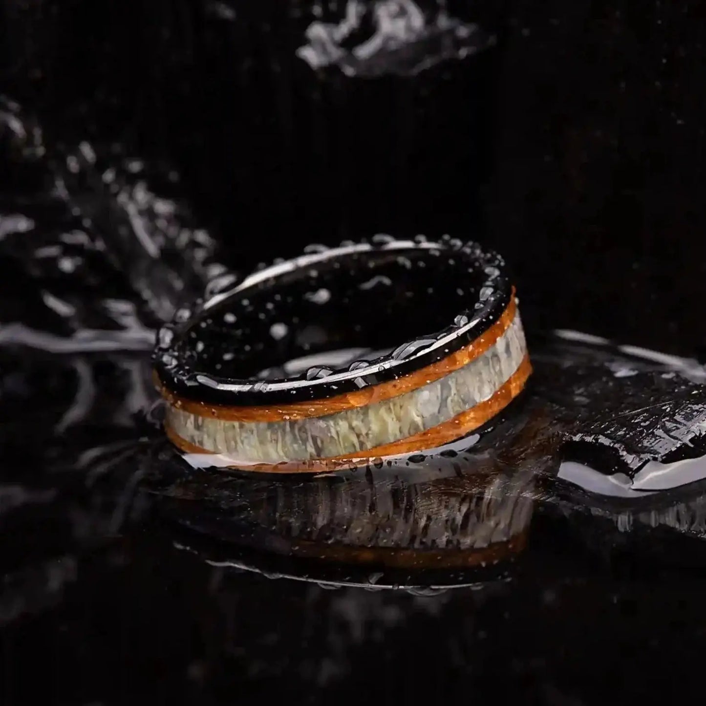 Brushed black tungsten ring with deer antler and whiskey barrel oak wood.