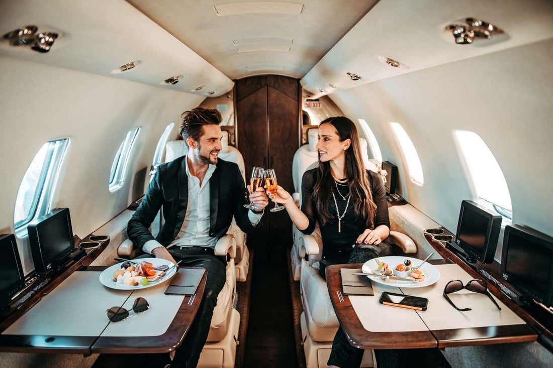 Man and woman sitting in a private jet 