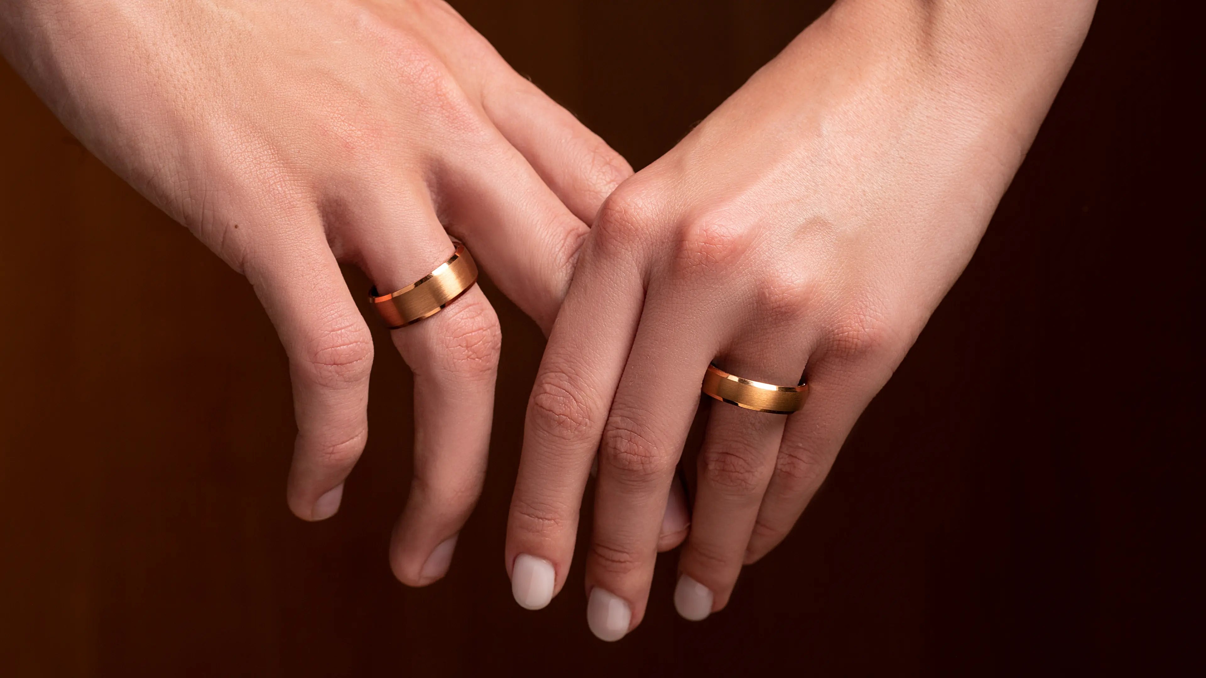 Rose tungsten ring set on a man and woman hands