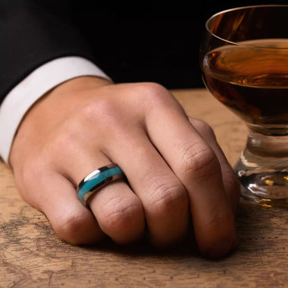 Handcrafted piece made of Turquoise and Tungsten. View on a man hand