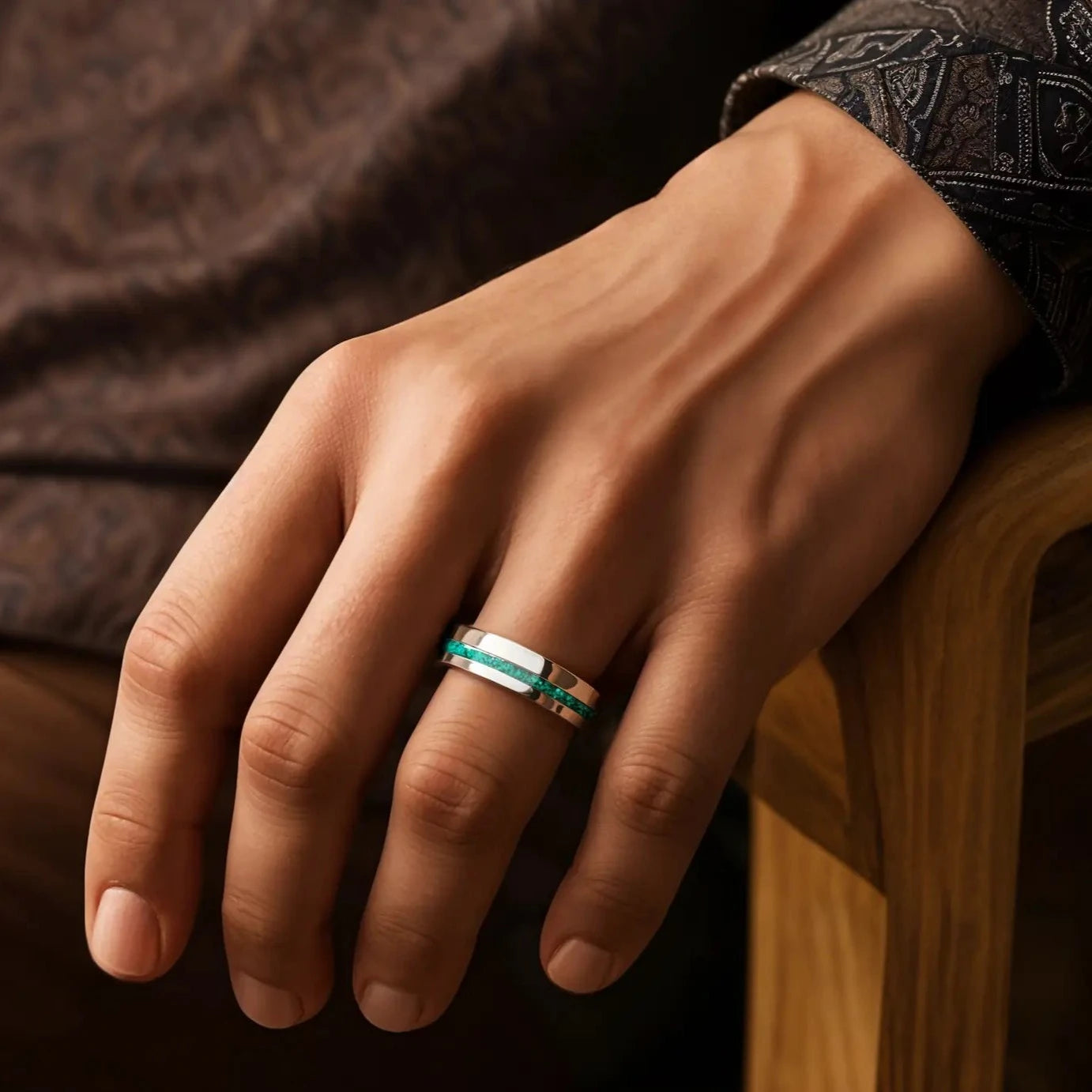 6mm silver tungsten ring with malachite. the ring is placed on a man's hand