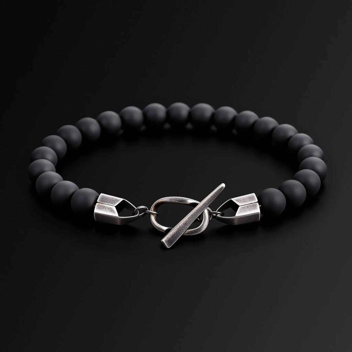 Black beaded bracelet with silver Japanese Melody