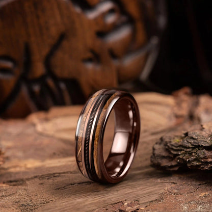 Brown brushed tungsten ring with guitar string and whiskey barrel oak wood