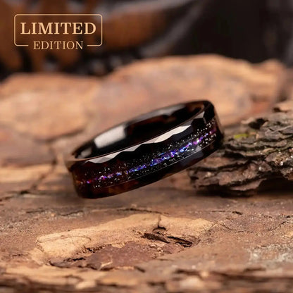 Close-up of Orion Nebula Ring, a unique hammered black tungsten carbide band with meteorite dust, 6mm width, ideal as a wedding band or promise ring.