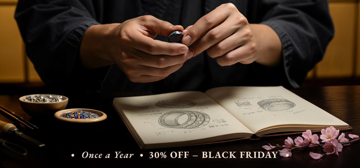 Person holding a small object over an open book with decorative elements on a table.