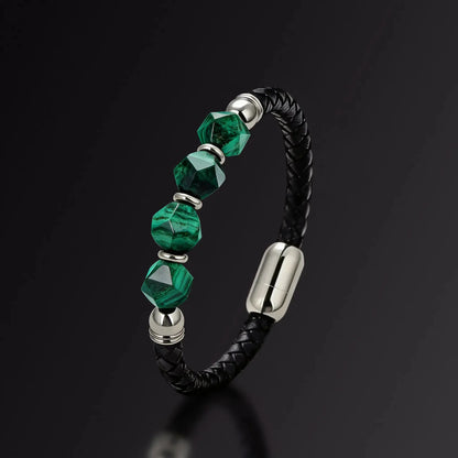 Bracelet with green beads and black leather strap on a dark background