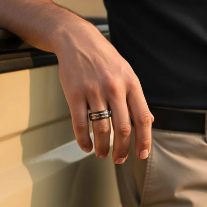 Close-up of a hand wearing a ring with a blurred background