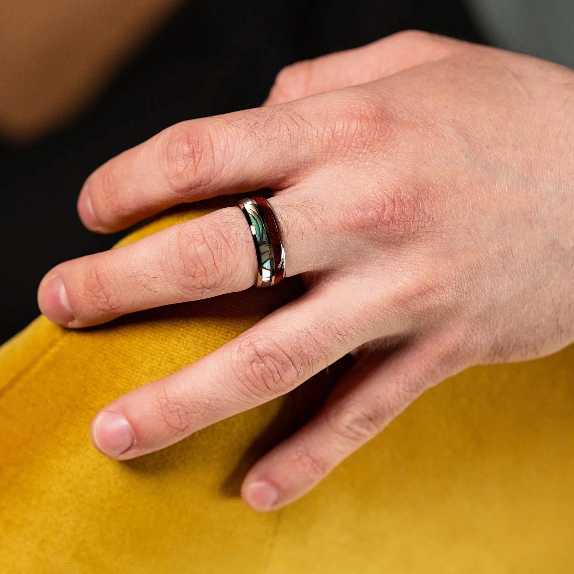 Ring made of Koa Wood & Abalone Shell on a man hand