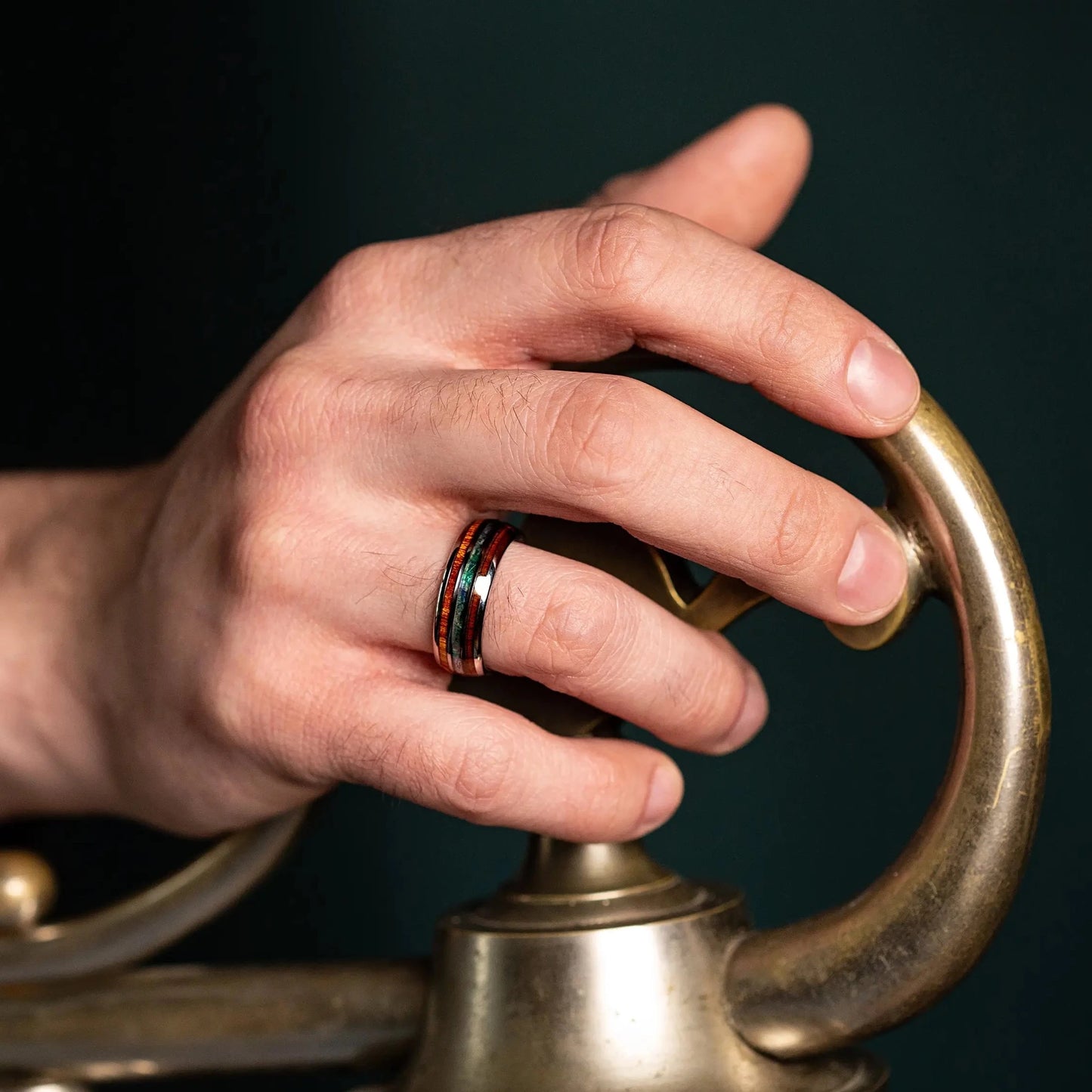 Ring made of Oak Wood and Abalone Shell on a man hand