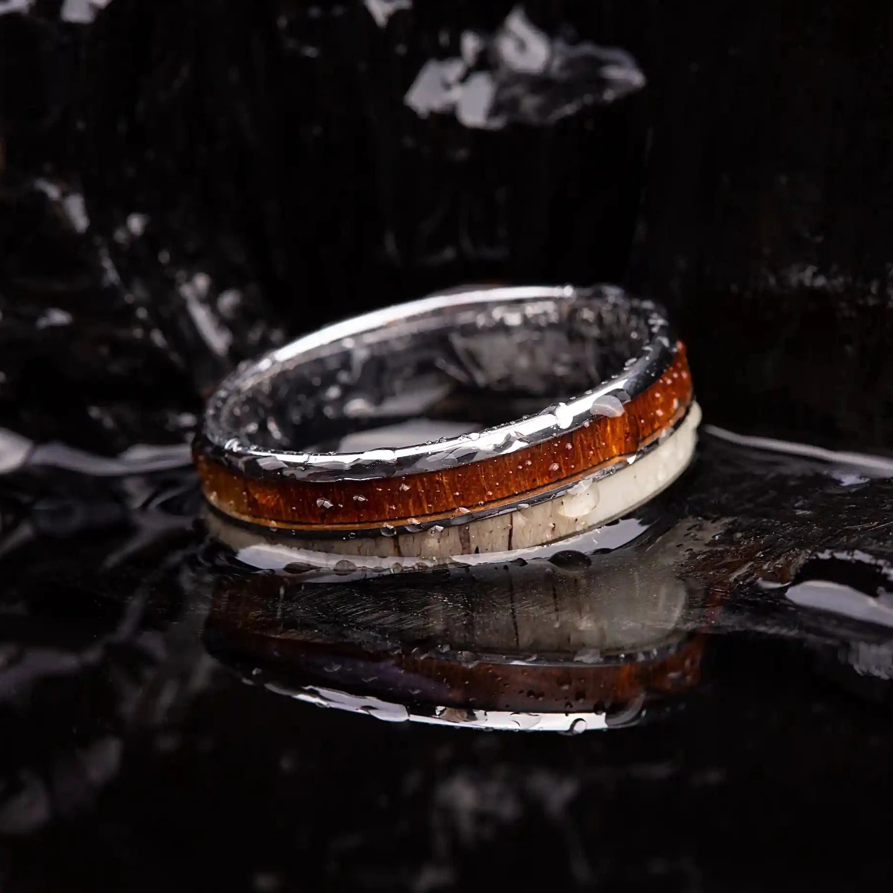 Silver brushed tungsten ring with deer antler and whiskey barrel oak wood