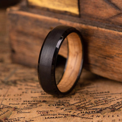 Unique Black Tungsten Ring with a genuine whiskey barrel wood inlay, featuring a minimalist design perfect for weddings or daily wear.