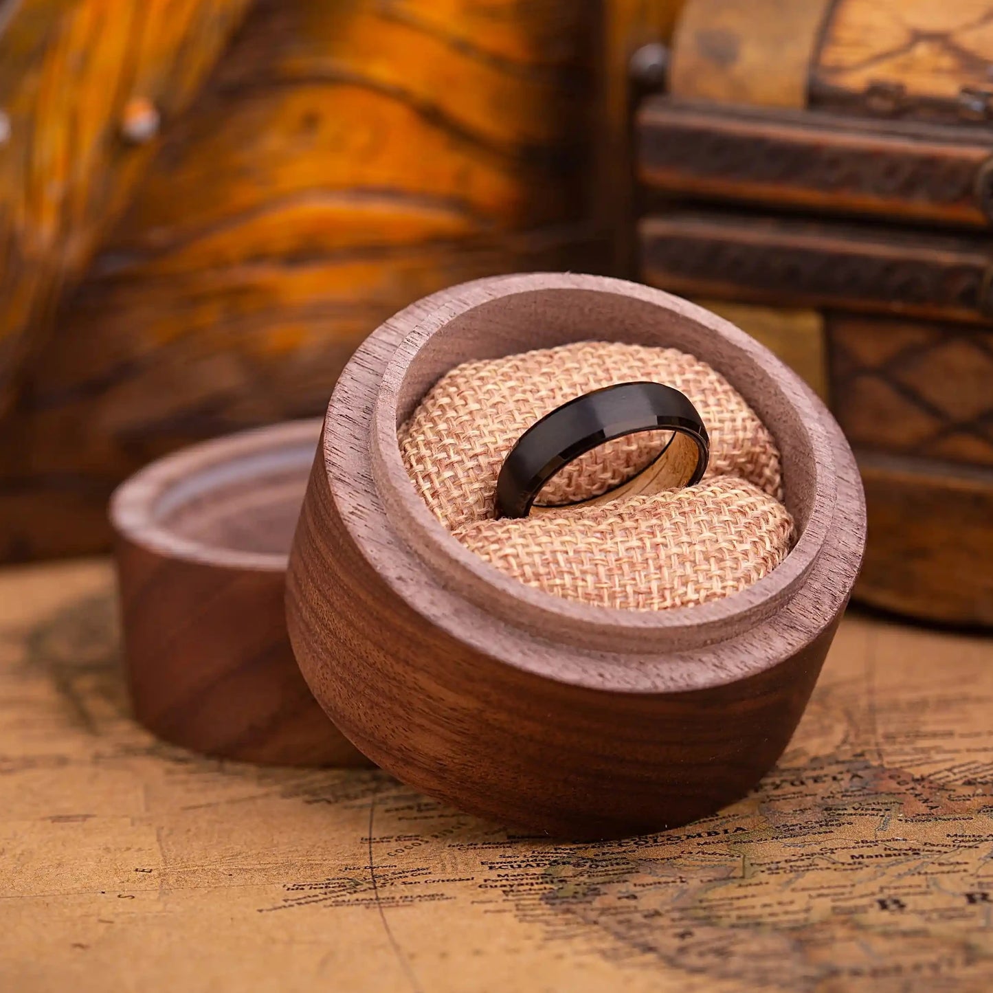 Handcrafted ring made of Oak Wood and tungsten. Version with band width 6 mm. The ring is placed inside a round wooden box.