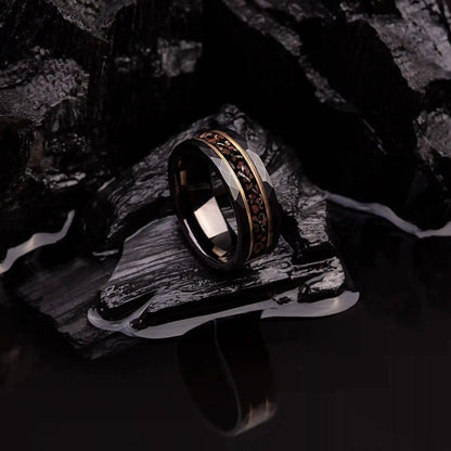 Black hammered tungsten ring with dinosaur bones and meteorite