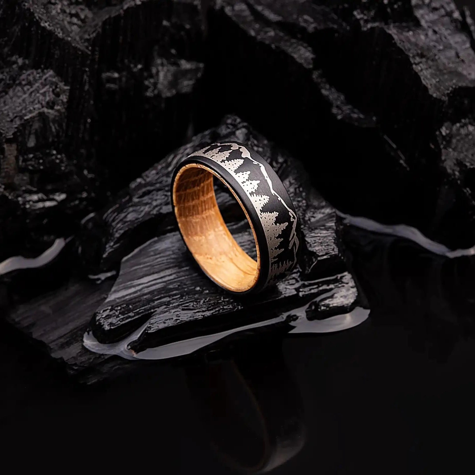 Black tungsten ring with engraved forrest