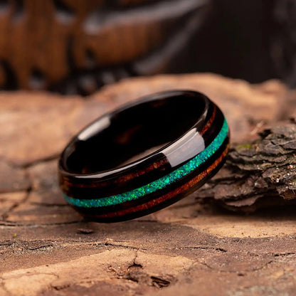 Black polished tungsten ring with green opal and whiskey barrel oak wood