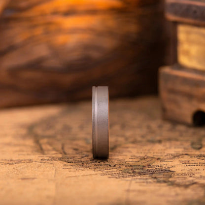 Handcrafted ring made of Oak Wood and Titanium. The ring has a width 4 mm