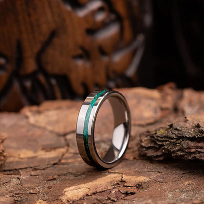 6mm silver tungsten ring with malachite. The ring is placed on a wood