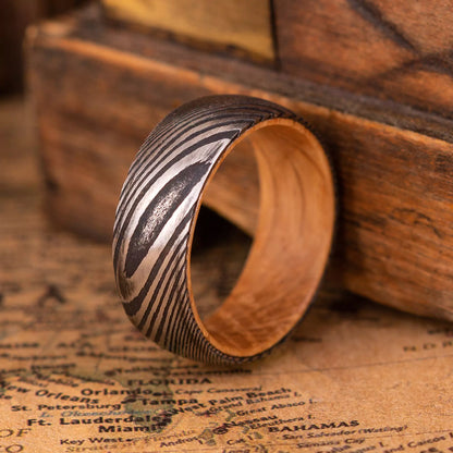 Man ring made of damascus steel and Oak Wood