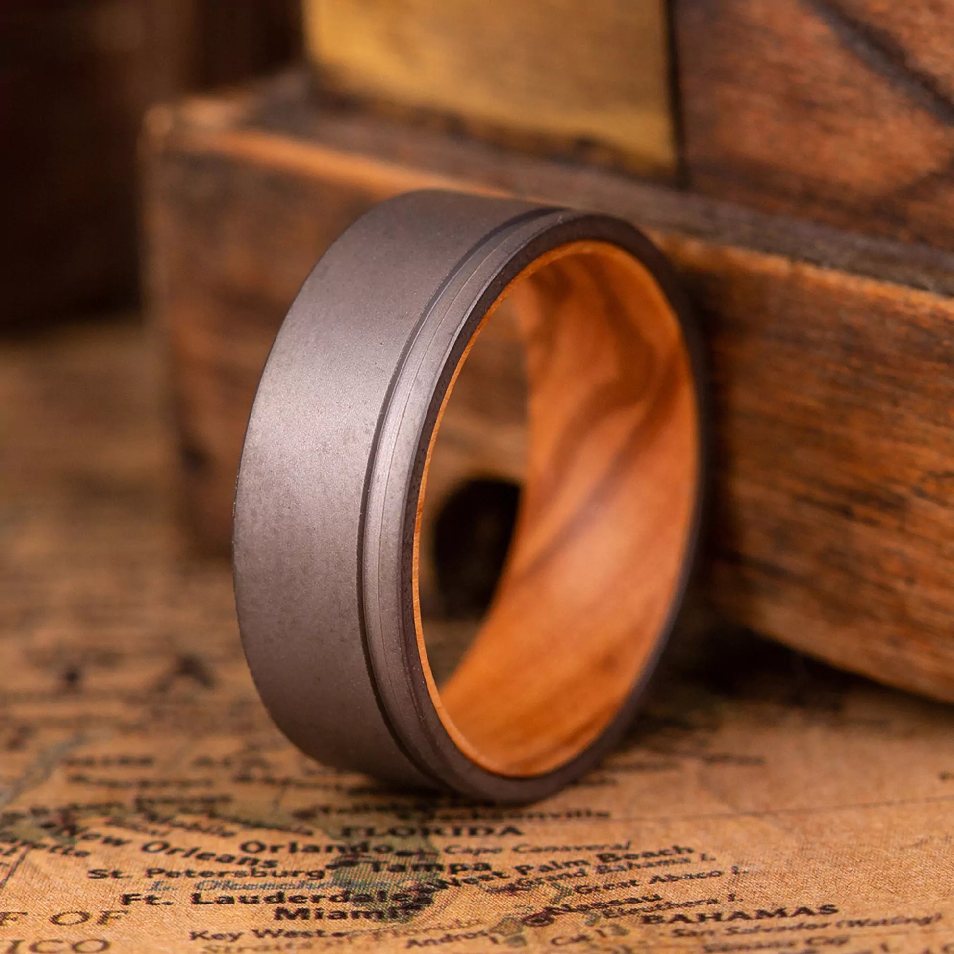 Handcrafted ring made of Oak Wood and Titanium. The ring has a width 8 mm.