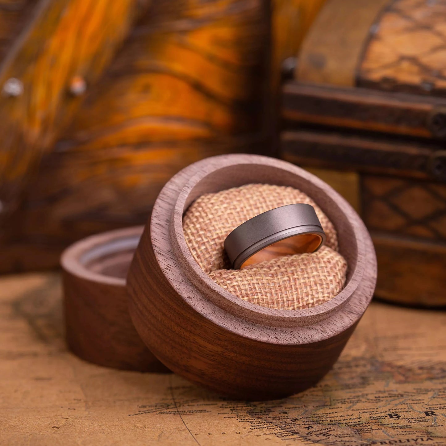 Handcrafted ring made of Oak Wood and Titanium in a gift box. The ring has a width 8 mm