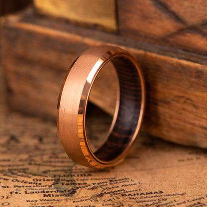 4 mm rose titanium ring with whiskey barrel oak wood inner layer