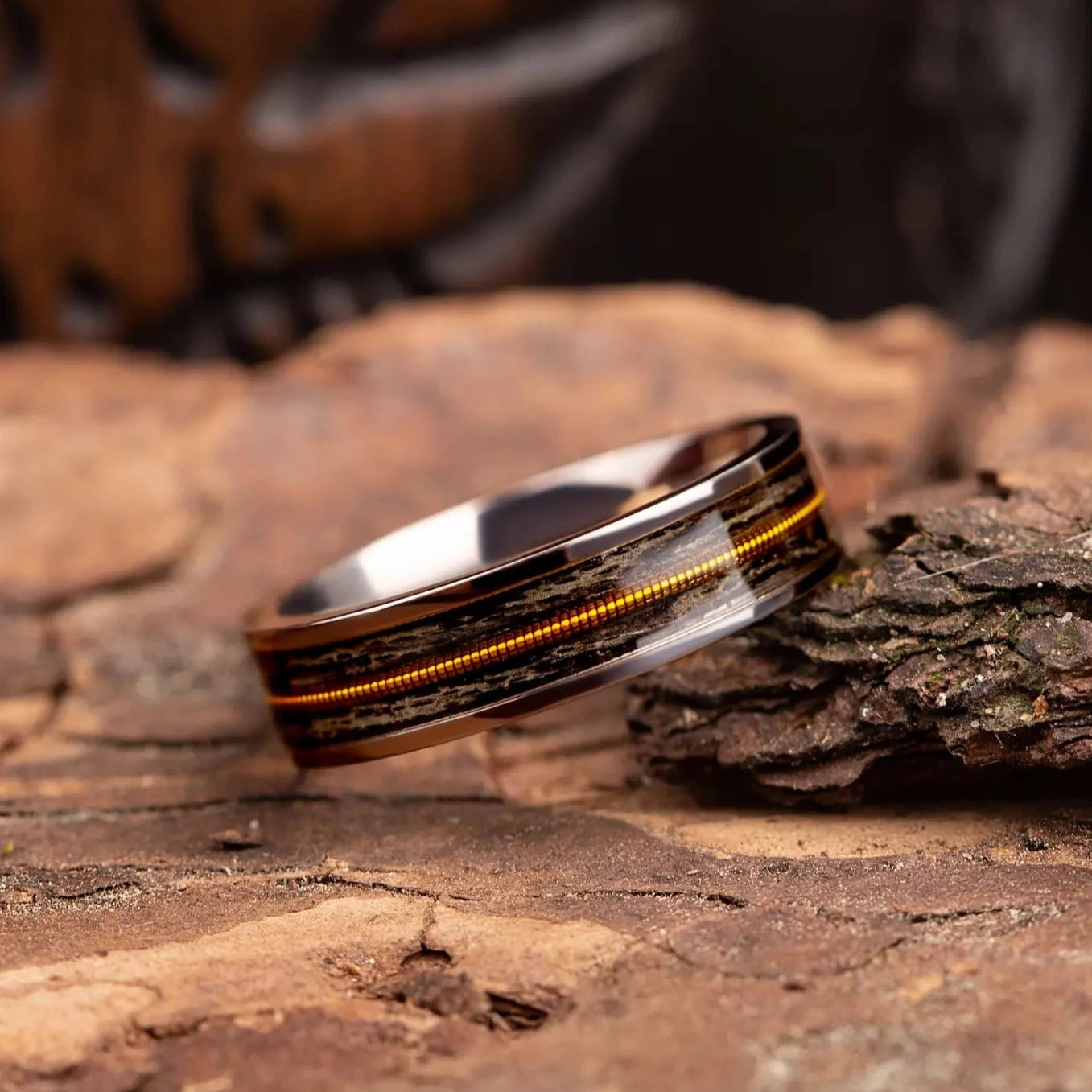 Titanium ring with guitar string and oak wood