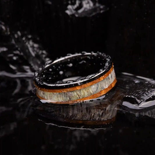 Brushed black tungsten ring with deer antler and whiskey barrel oak wood.