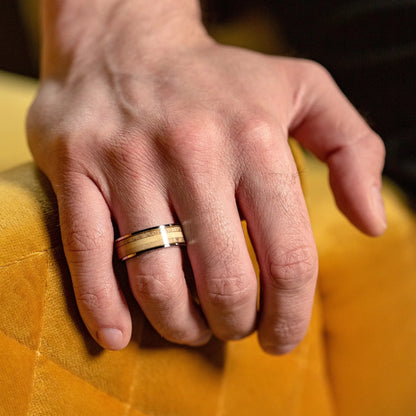 This ring made of Deer Antler and Silver Tungsten on a man hands, that hold glass of whiskey