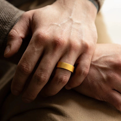 Ring made of Walnut wood and Tungsten. View on a man hand