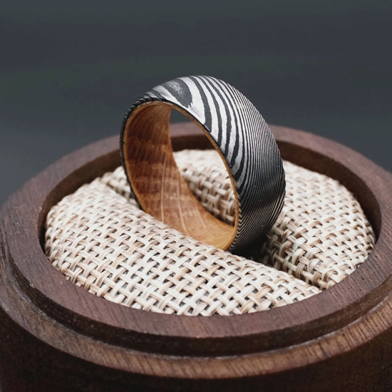 Man ring made of damascus steel and Oak Wood