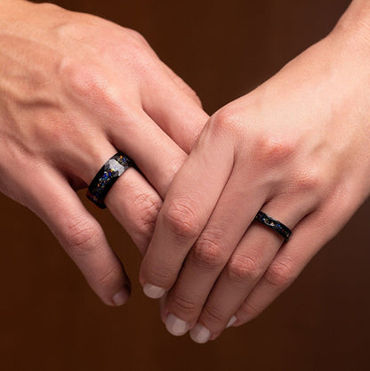 Two Rings made of Galaxy Opal & Meteorite. Band width 8 and 4 mm. Rings are on a woman and a man hands